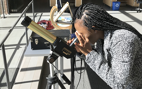 Student using Telescope